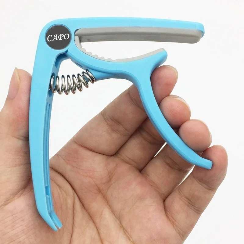 Capo gitar plastik 6 dawai ele - Musical Instrument Gif ulasan dan harga